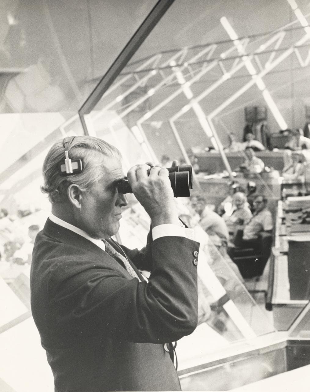 Wernher von Braun watches the Apollo 15 launch through binoculars in 1971